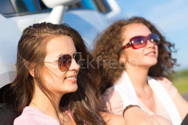 Two attractive young women wearing sunglasses Stock photo © adam121