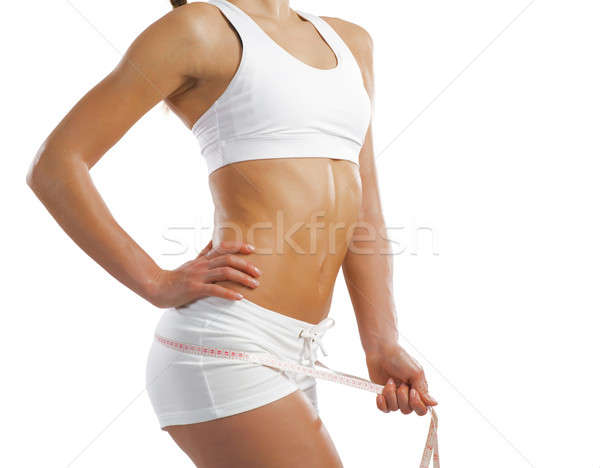 young athletic woman measuring waist Stock photo © adam121