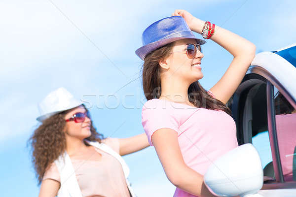 Two attractive young women wearing sunglasses Stock photo © adam121