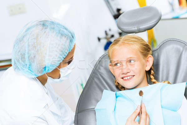 Dentist inspecting patient Stock photo © adam121