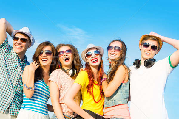 Stock photo: group of young people wearing sunglasses and hat