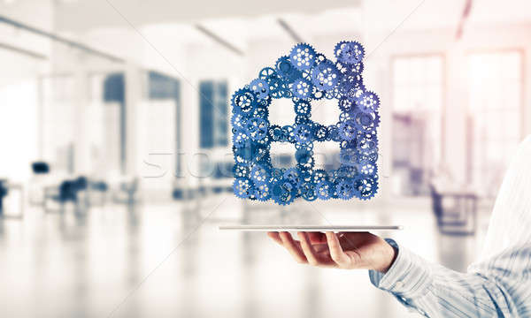 Real estate or construction idea presented by home icon on table Stock photo © adam121