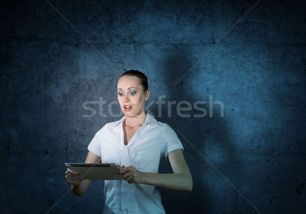 young attractive woman holding a tablet Stock photo © adam121