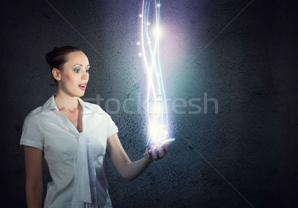 young attractive woman holding a cell phone Stock photo © adam121