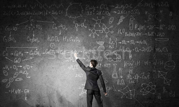 Wetenschapper schrijven formules schoolbord jonge man pak Stockfoto © adam121