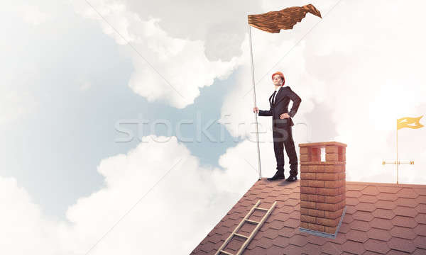 Young businessman with flag presenting concept of leadership. Mi Stock photo © adam121