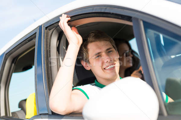Férfi leragasztott kéz ki ablak fiatalember Stock fotó © adam121