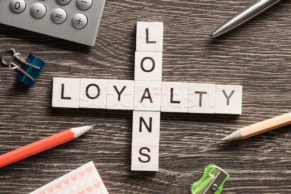 Loans and loyalty crossword puzzle collected of game wooden cubes Stock photo © adam121