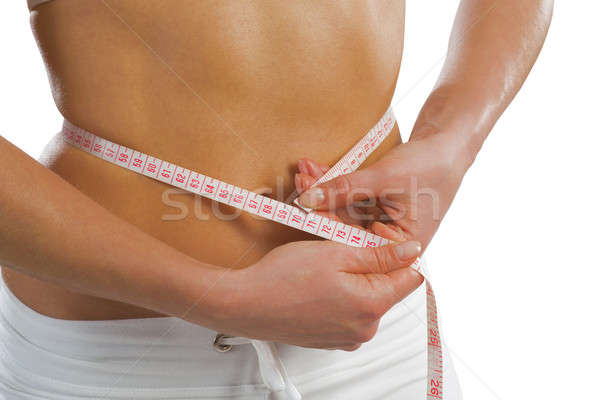 young athletic woman measuring waist Stock photo © adam121