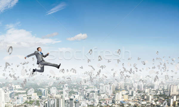 Businessman jumping high Stock photo © adam121