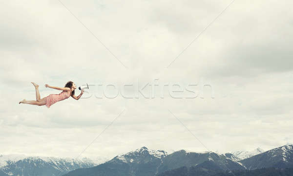 ücretsiz hızlı genç kadın megafon uçan yüksek Stok fotoğraf © adam121
