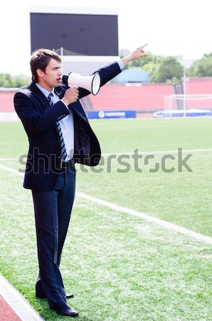 Stock photo: athletic trainer instructs the team