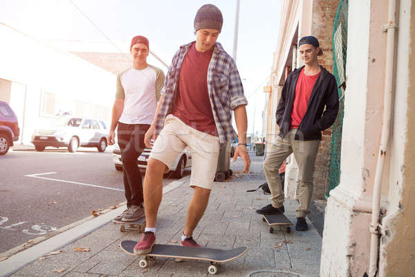 Guys skateboarders in street Stock photo © adam121