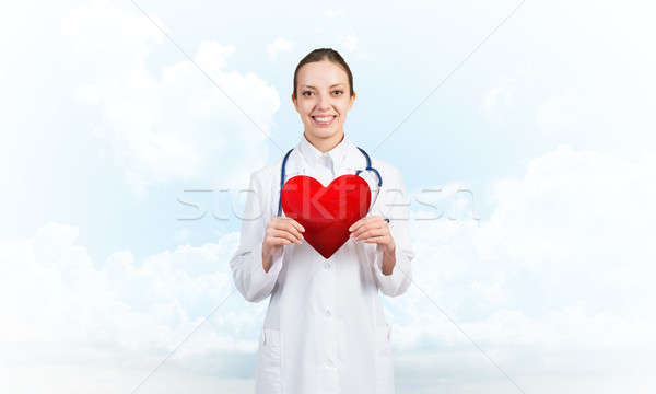 Vérifier coeur santé jeune femme médecin ciel [[stock_photo]] © adam121
