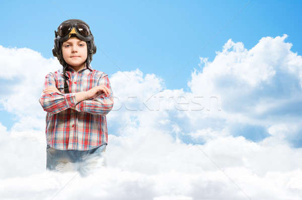 Boy in helmet pilot dreaming of becoming a pilot Stock photo © adam121