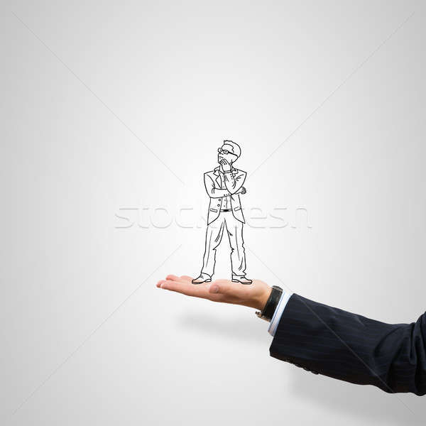 Stock photo: Caricatures of businessman in palm