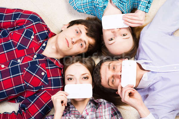 four young men lie together Stock photo © adam121