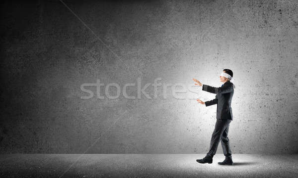 Business concept of risk with businessman wearing blindfold in empty concrete room Stock photo © adam121