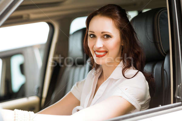 若い女性 新しい車 ショールーム 笑みを浮かべて 見える カメラ ストックフォト © adam121