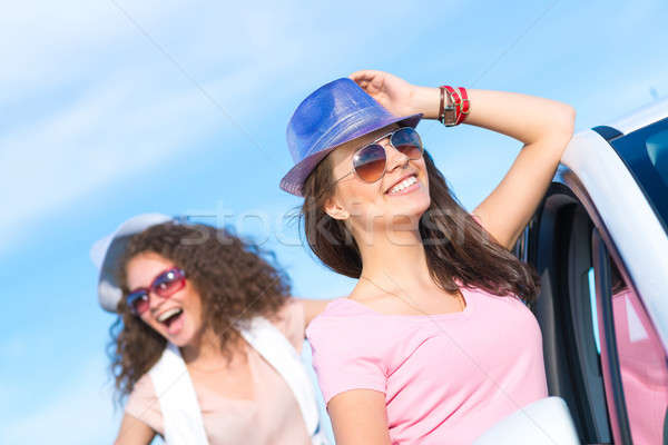 Two attractive young women wearing sunglasses Stock photo © adam121