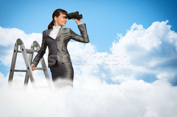 businesswoman looking through binoculars Stock photo © adam121