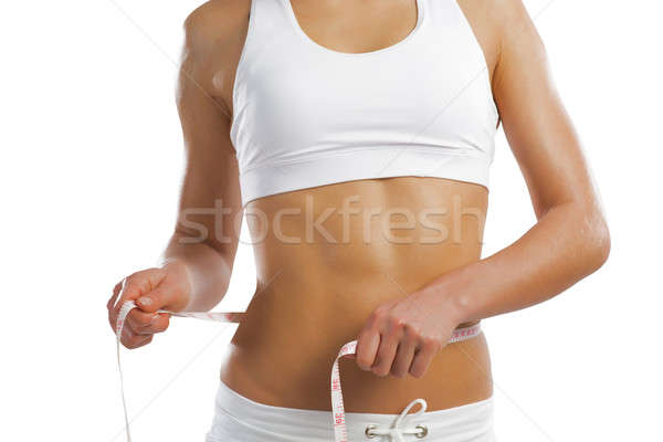 young athletic woman measuring waist Stock photo © adam121