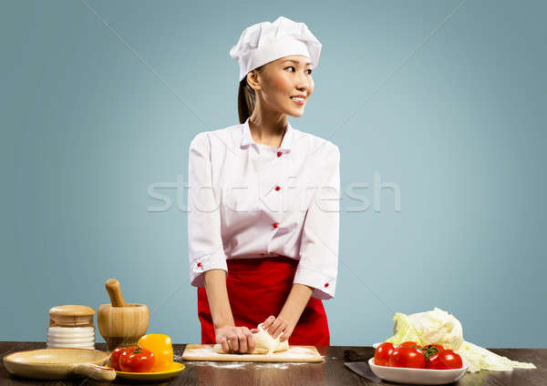 Asian female chef cooking pizza dough Stock photo © adam121