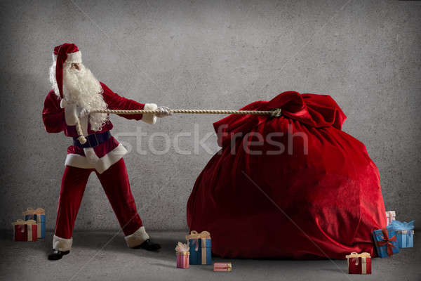 Papá noel enorme bolsa regalos alrededor cajas Foto stock © adam121