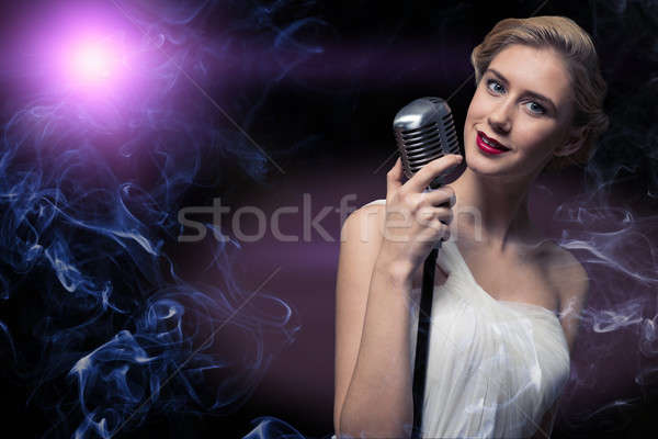 Mulher atraente cantora microfone atrás abstrato moda Foto stock © adam121