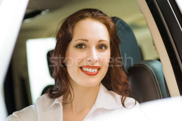 young woman in the new car in the showroom Stock photo © adam121