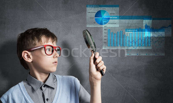 Curious school boy with magnifier Stock photo © adam121