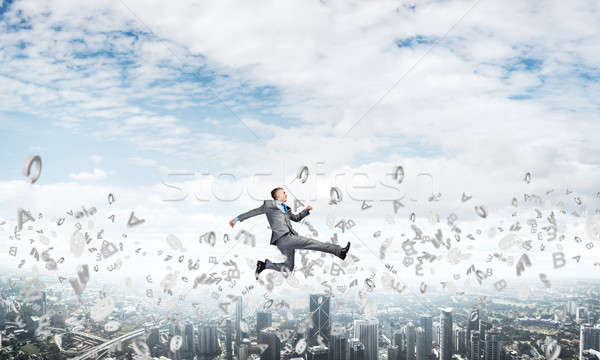 Businessman jumping high Stock photo © adam121