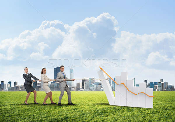 Businessteam working in collaboration making diagram grow and progress Stock photo © adam121