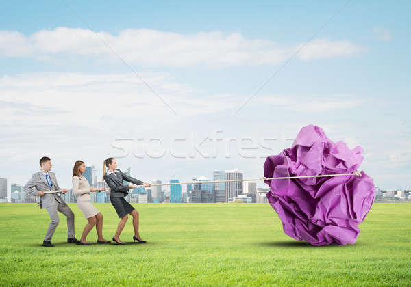 Young business people outdoors and huge paper ball as symbol of creativity Stock photo © adam121