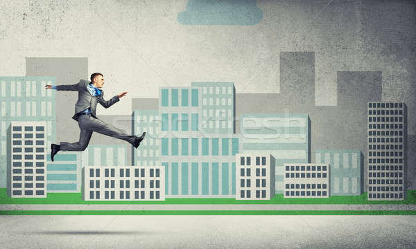 Businessman jumping high Stock photo © adam121