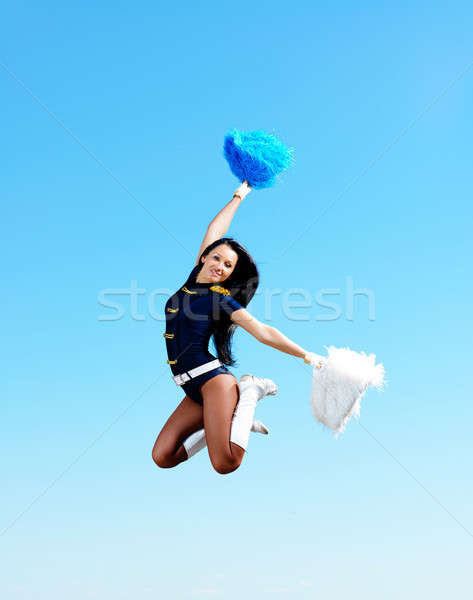 Majoreta fată jumping Blue Sky modă sări Imagine de stoc © adam121