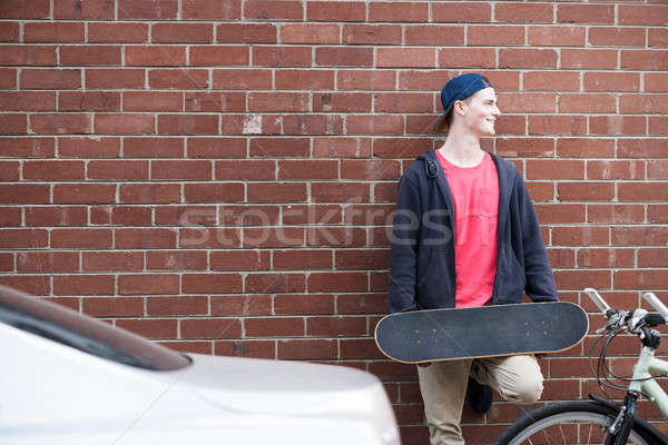 Handsome guy with skateboard Stock photo © adam121