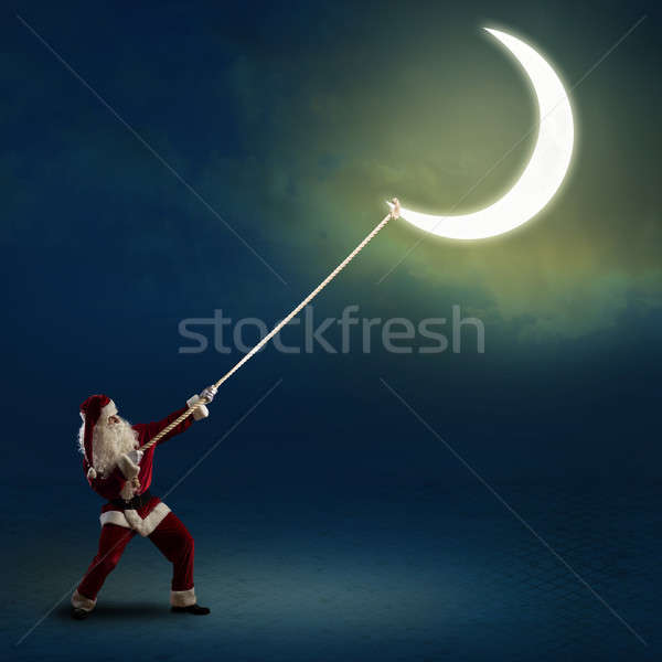 Santa Claus pulls the moon Stock photo © adam121