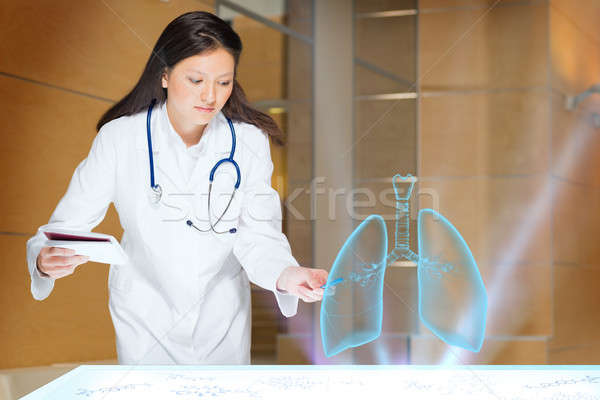 young woman doing research Stock photo © adam121