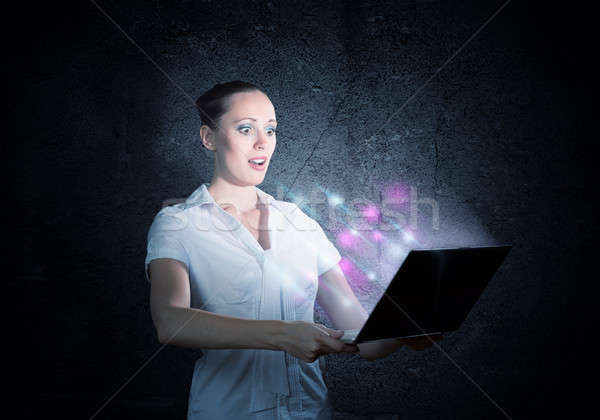 young attractive woman holding a laptop Stock photo © adam121