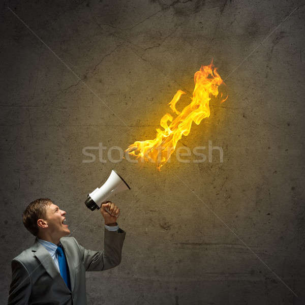Agresiv administrare tineri om de afaceri tipa incendiu Imagine de stoc © adam121