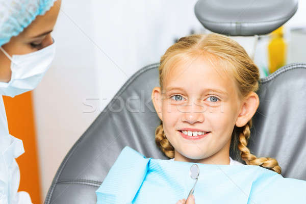 Dentist inspecting patient Stock photo © adam121