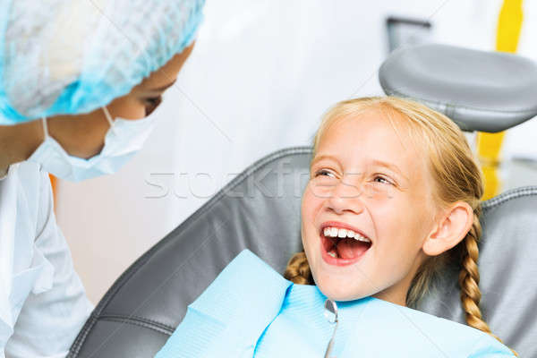 Dentist inspecting patient Stock photo © adam121