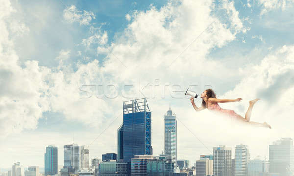Wolna pośpieszny młoda kobieta megafon pływające wysoki Zdjęcia stock © adam121