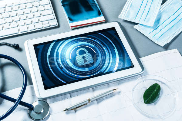 Web security and technology concept with tablet pc on table Stock photo © adam121