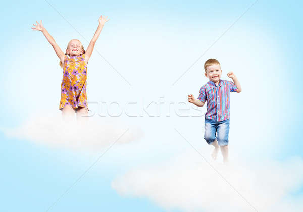 girl and boy  on clouds and a rainbow Stock photo © adam121