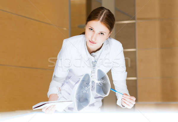 young woman doing research Stock photo © adam121