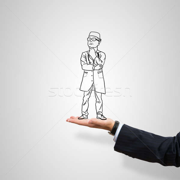 Stock photo: Caricatures of businessman in palm