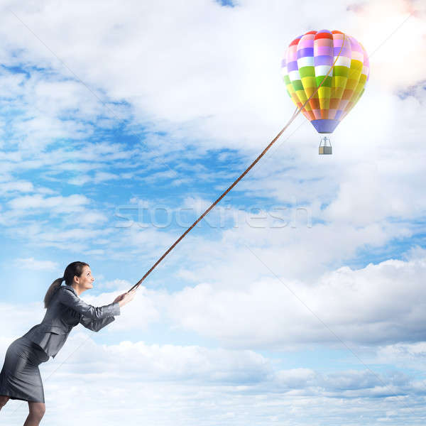 Stock photo: Woman catch balloon