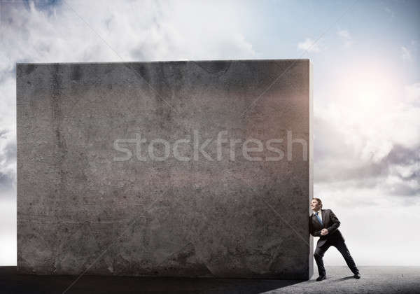 бизнесмен стены молодые усилие Сток-фото © adam121